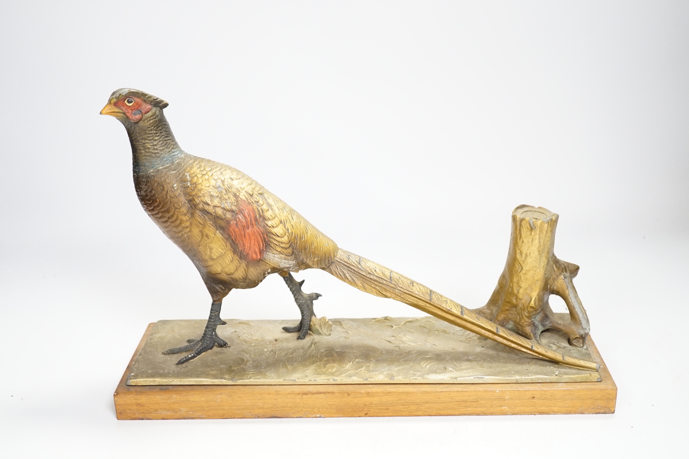 A cold painted spelter table striker, in the form of a pheasant, 31.5cm wide